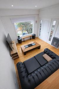 a living room with a couch and a table at CIELO AUSTRAL house overlookin the ocean in Ushuaia