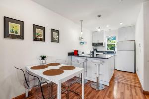 a kitchen with a white table and a white refrigerator at 08 Lodge in Hood River