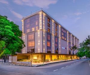 a large building with lights on the side of a street at SkkyLight Lords Inn Nanded in Nānded