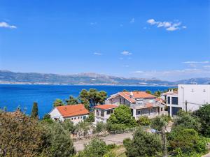 a view of houses and the water at Apartments Sofija in Slatine