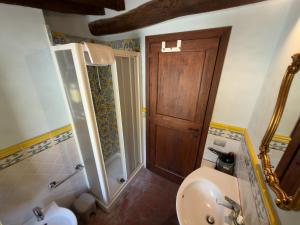 a bathroom with a toilet and a sink at Le Torri View Apartment - San Gimignano in San Gimignano