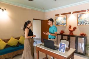 a man and a woman standing in a room at Victor Exotica An Indy Resort in Candolim +160 photos