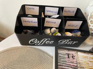 a box of coffee bits sitting on top of a table at Casa Sorriso in Bergamo