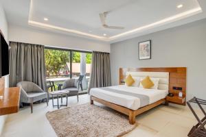 a hotel room with a bed and a balcony at asar Upper House Morjim Beach by Orion Hotels in Morjim +156 photos