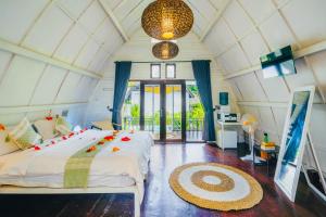a bedroom with a large bed in a room at Villa on Air in Gili Islands +95 photos