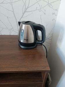 a toaster sitting on top of a wooden table at casaisabel in Bordeaux