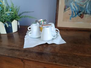 a table with two tea sets on a napkin at casaisabel in Bordeaux