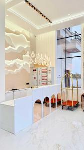a kitchen with a white counter with a chandelier at Mandhata Riverview Palace in Mortakka