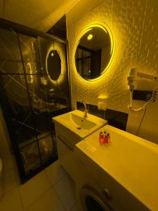 a bathroom with a sink and a mirror at Poli House in Kasaplar +10 photos