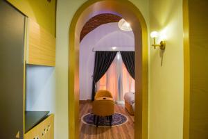 a room with an archway and a chair in a room at New Panorama Resort in Fayoum