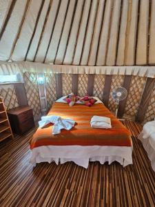 a bedroom with a bed in a yurt at Loma Sanchez in San Pedro de Atacama