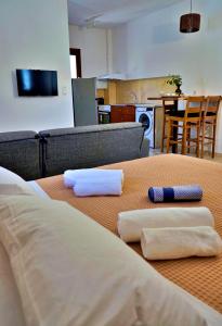 a table with two towels sitting on top of it at Gefyra Studios Filoti Naxos in Filótion