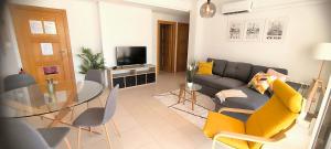 a living room with a couch and a glass table at Nice Groundfloor Apartment - BO202LT in Torre-Pacheco