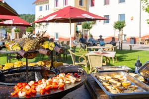 a table with a bunch of food on it at Familienhotel "Rhön Feeling" in Bernshausen