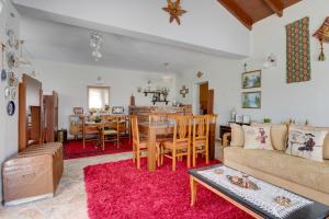 a living room with a couch and a table at Bujtina Ethan Perondi - Private Villa Swimming Pool in Kuçovë +31 photos