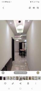 a room with a table and a dining room at #302 brand new two large bedrooms in Rujm ash Sharāʼirah