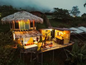 an aerial view of a house with a roof at ตั้วบ้านดิน Tuabaandin in Ban Thung Phan Ha