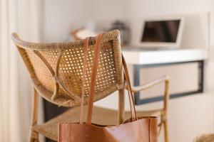 a chair with a bag hanging from it at Barrington's in Plettenberg Bay