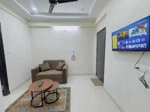 a living room with a couch and a table at B2 601 1BHK Flat by Charter Stays in Hyderabad