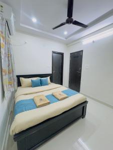 a bedroom with a bed with two pillows on it at B2 601 1BHK Flat by Charter Stays in Hyderabad +6 photos