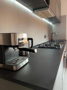 a kitchen with a coffee maker on a counter at attico19 in Montecatini Terme