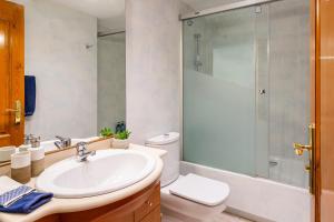 a bathroom with a sink and a toilet and a shower at Apartament Sant Antoni de Calonge in Sant Antoni de Calonge +18 photos