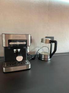 a coffee maker sitting on top of a counter at attico19 in Montecatini Terme