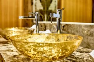 two sinks in a bathroom with two faucets at Jagd Chalet in Leutasch