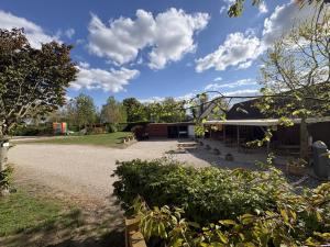 a building with a gravel driveway in front of it at camping de la mottelette in Forest-Montiers