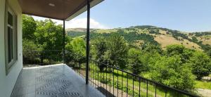 a balcony with a view of a mountain at Naz in Lerik