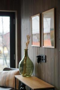 a green vase sitting on top of a table at Modern One-Bedroom Apartment in Henningsvær in Henningsvær