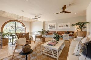 a living room with a couch and a table at Barrington's in Plettenberg Bay