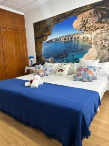 a bedroom with a bed with a view of the ocean at Hotel Argos in Calasparra +49 photos