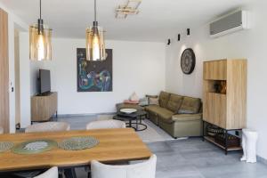 a living room with a table and a couch at Villa Bartula in Bar