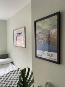 a picture hanging on a wall in a bedroom at Bedroom 2 with a little loo in King's Lynn