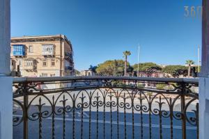 a balcony with a iron fence and a building at Private Room in Hamrun HMR006 in Hamrun