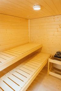a small wooden sauna with two beds in it at Pulheim Room in Pulheim