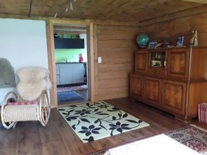 a room with a wooden room with a wooden floor at DesAlpes in Saxeten