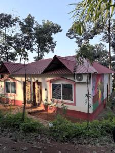 a house with a painting on the side of it at Shankars Resort in Guwahati