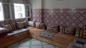 a living room with couches in a room at appartement bab boujloud in Fez