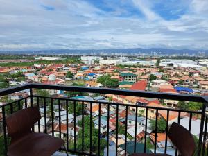 a view of a city from a balcony at Royal oceancrest mactan in Mactan Island +3 photos