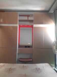 a bedroom with a bed and a window at Royal oceancrest mactan in Mactan Island