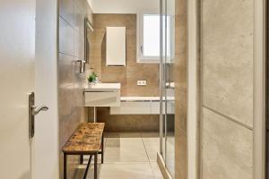 a small bathroom with a sink and a table at Villa Le Deck - Grande maison familliale proche plage in Arcachon +28 photos