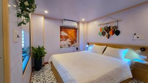a bedroom with a white bed in a room at AM's Home in Ninh Binh