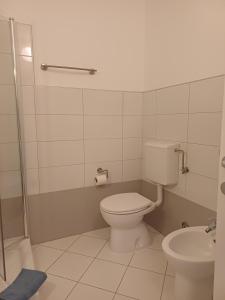 a bathroom with a toilet and a sink at Studio Apartment Ivo in Cres +4 photos