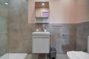 a bathroom with a sink and a toilet at Private Room in Hamrun HMR006 in Hamrun +81 photos