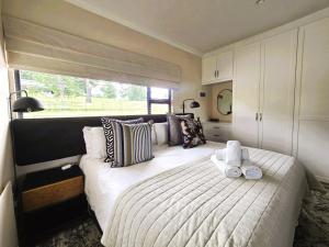 a bedroom with a large bed and a window at Fairfax Studio in Nottingham Road