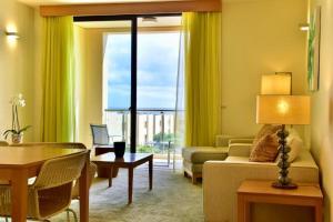 a living room with a couch and a table at The Navigator - Colombus in Porto Santo