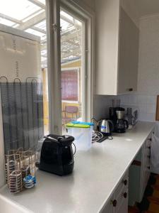 a kitchen with a counter top with a toaster on it at Central Villa Hultsfred Vimmerby in Hultsfred