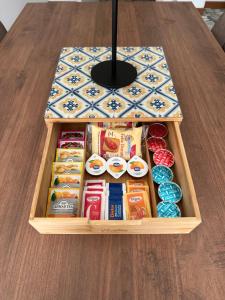 a wooden box filled with different types of food at Casa Serena in Baveno